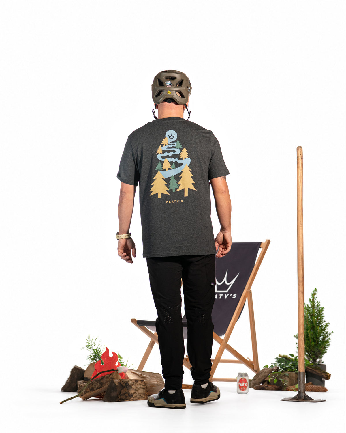 Model wearing the Dark Heather Grey Peaty's Dusk to Dawn T-shirt, rear view showing printed woodland riding artwork