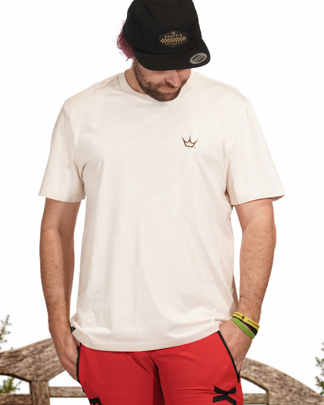 Rider wearing Vintage White Peaty's Descend T-shirt, showing its front crown chest detail