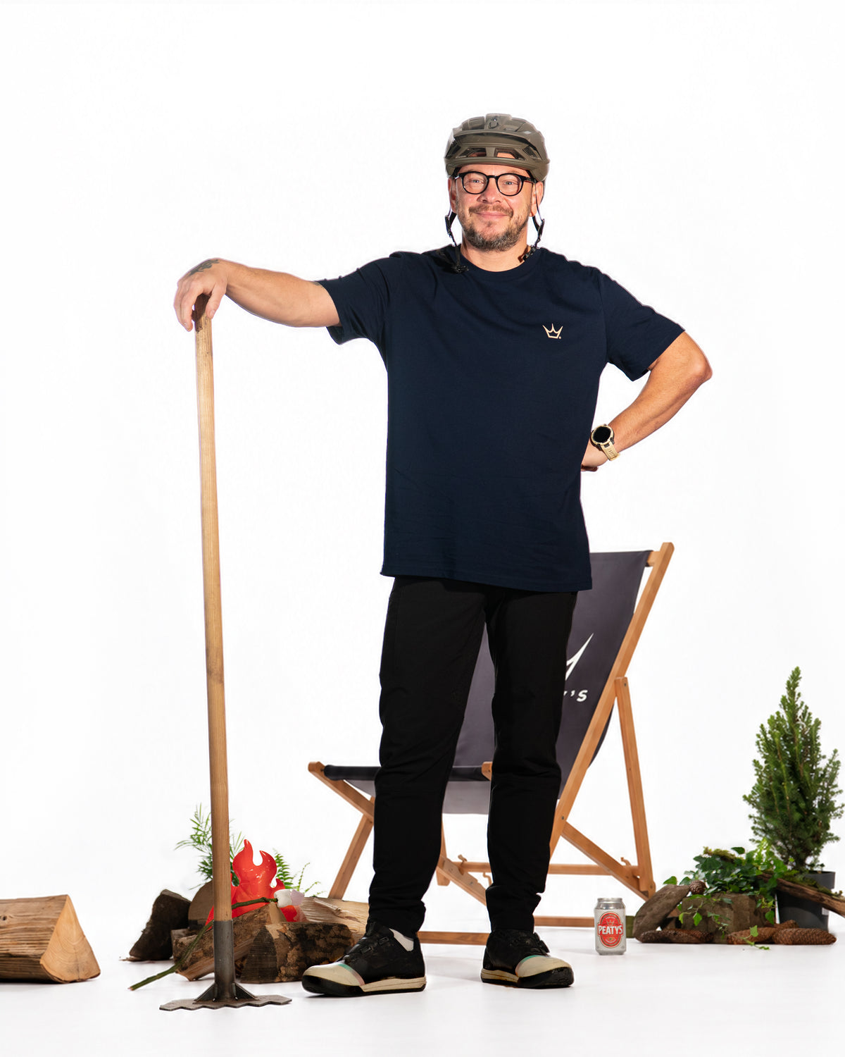 Spare clean-background photograph of rider wearing the French Navy Peaty's Dusk to Dawn T-shirt