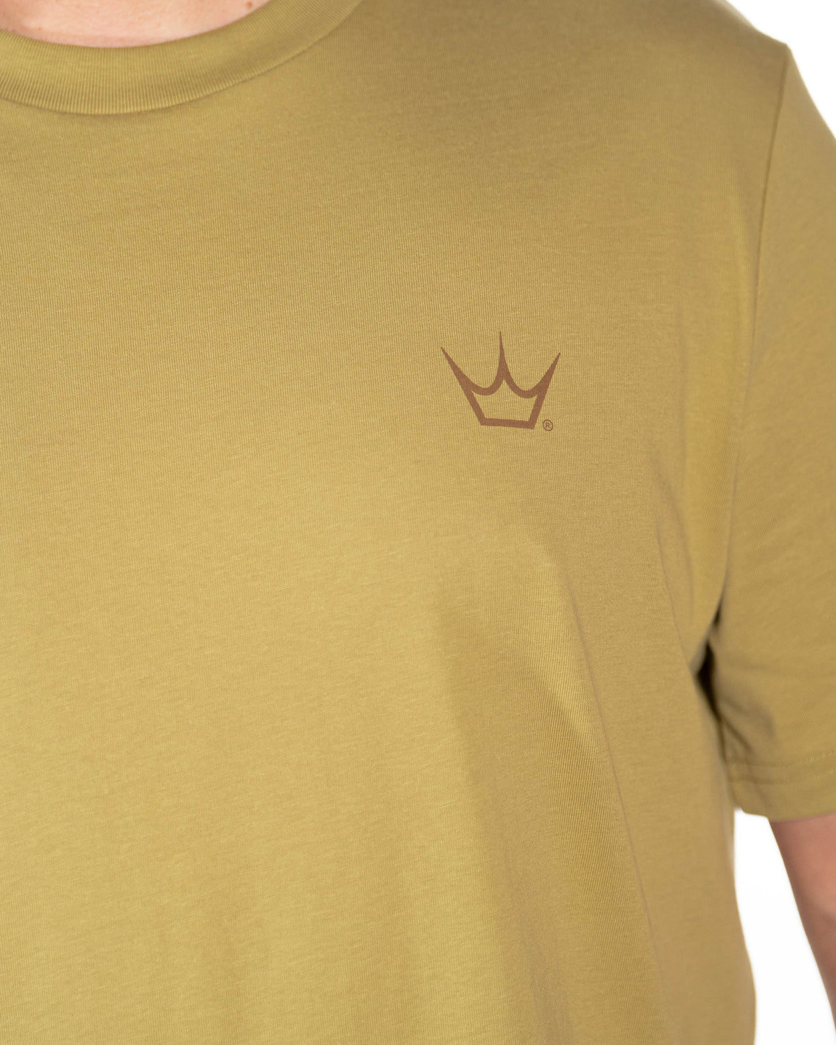 Close-up of the crown chest branding and cotton fabric on the Olive Peaty's Dusk to Dawn T-shirt